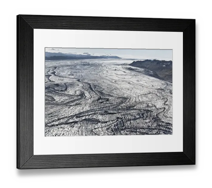 Framed Print : Aerial view, lines and structures consisting of volcanic ash and black lava in the ice and snow of Vatnajoekull glacier