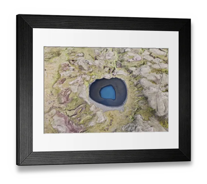 Framed Print : Aerial view, a blue crater lake surrounded by moss-covered mountains Framed Print : Aerial view, a blue crater lake surrounded by moss-covered mountains