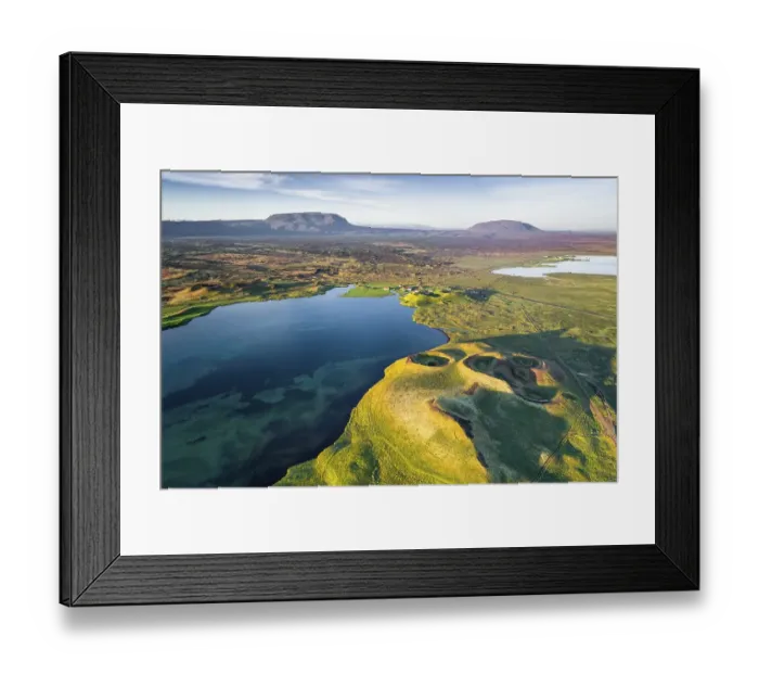 Framed Print : Aerial view of coast with green pseudo-craters