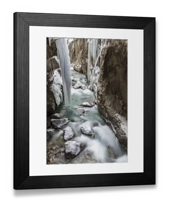 Framed Print : Wild river Partnach in the Partnachklamm with long icicles and snow in winter Framed Print : Wild river Partnach in the Partnachklamm with long icicles and snow in winter