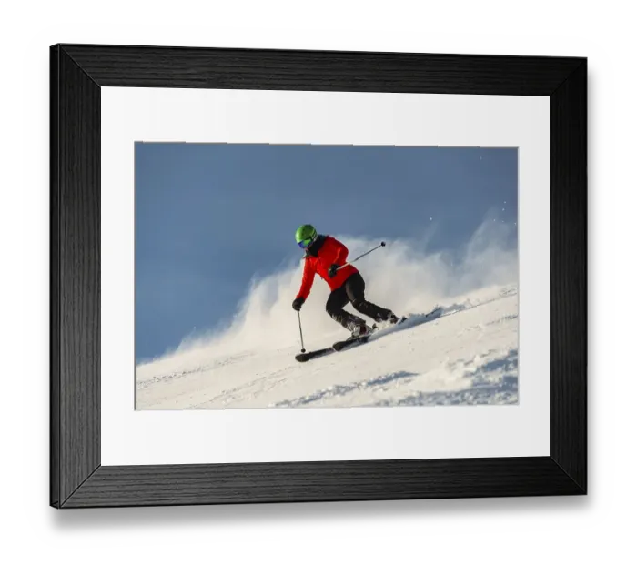 Framed Print : Female skier descending steep slope Framed Print : Female skier descending steep slope