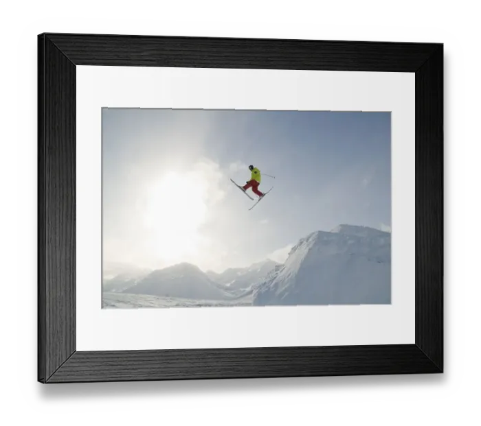 Framed Print : Skier in front of the sky and the sun