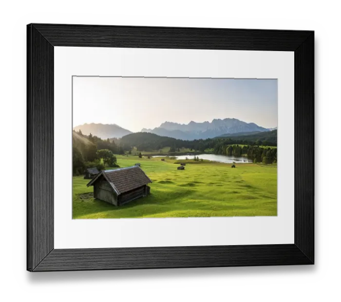 Framed Print : Meadow with small huts, hay barns Framed Print : Meadow with small huts, hay barns