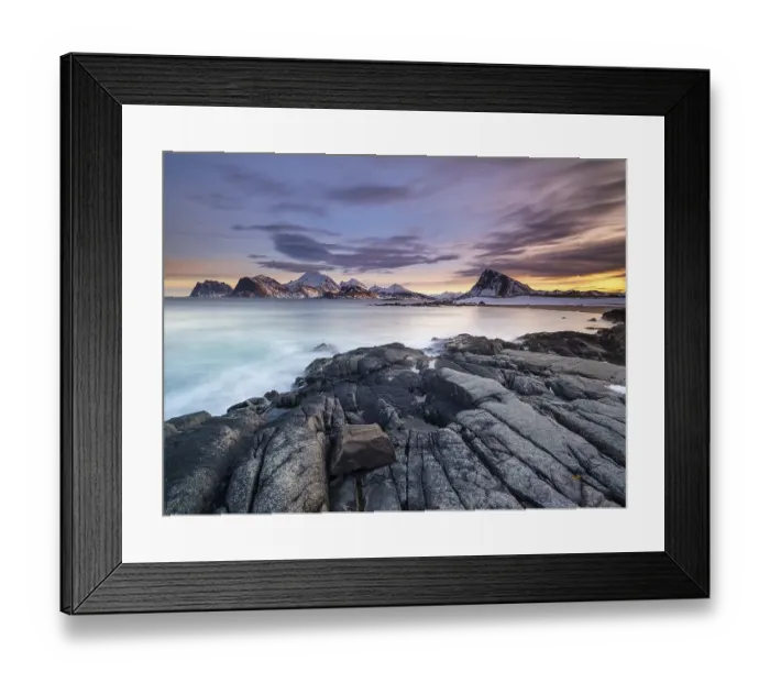 Framed Print : Rocky coast, snow-capped mountains in the background Framed Print : Rocky coast, snow-capped mountains in the background