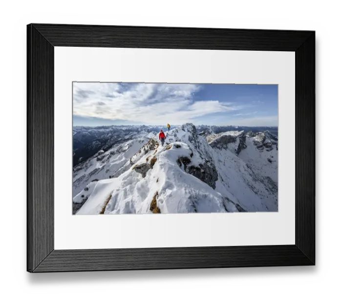 Framed Print : Two mountaineers on a narrow rocky snowy ridge