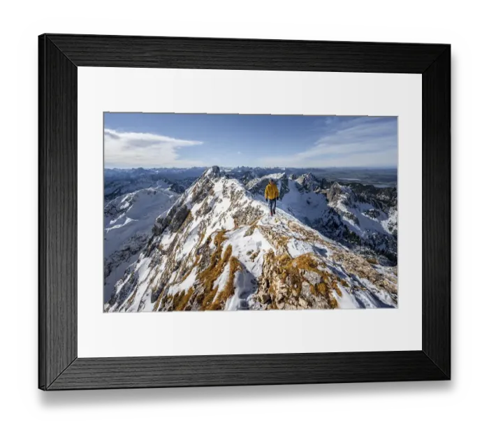 Framed Print : Climbers on a narrow rocky snowy ridge