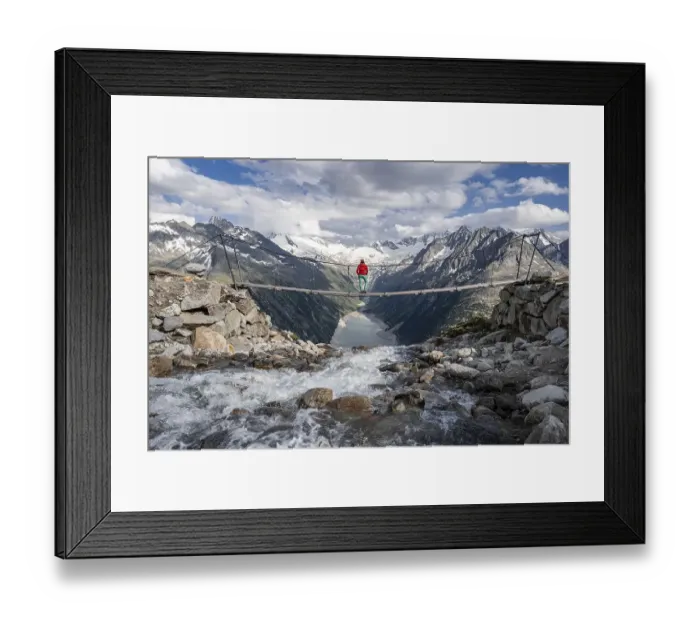 Framed Print : Hiker, woman on suspension bridge at the Olpererhuette