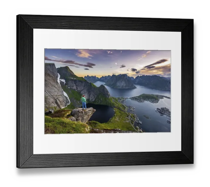 Framed Print : Evening atmosphere, young hiker standing on a rocky outcrop and enjoying the view from Reinebringen