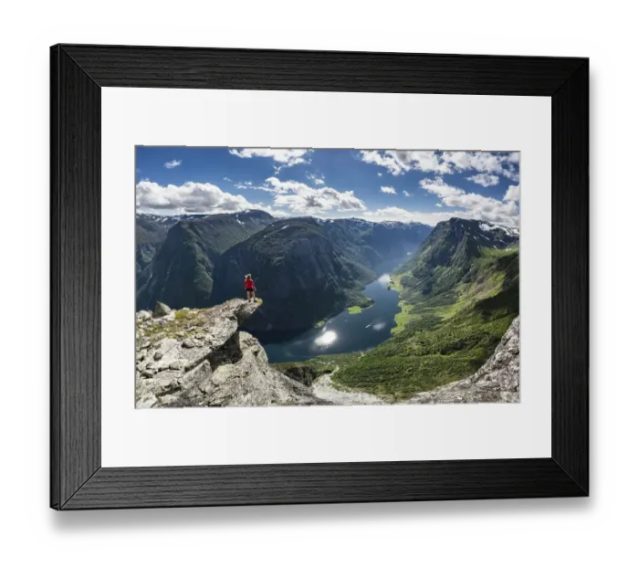 Framed Print : Hiker standing on rocky outcrop Framed Print : Hiker standing on rocky outcrop