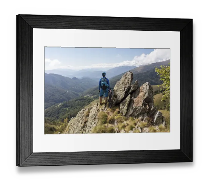 Framed Print : E-Mountainbiker enjoys the view from a mountain above Bogno Framed Print : E-Mountainbiker enjoys the view from a mountain above Bogno