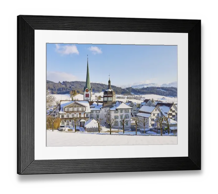 Framed Print : Snow-covered village view with typical Appenzell houses facing south with the Reformed church in the back