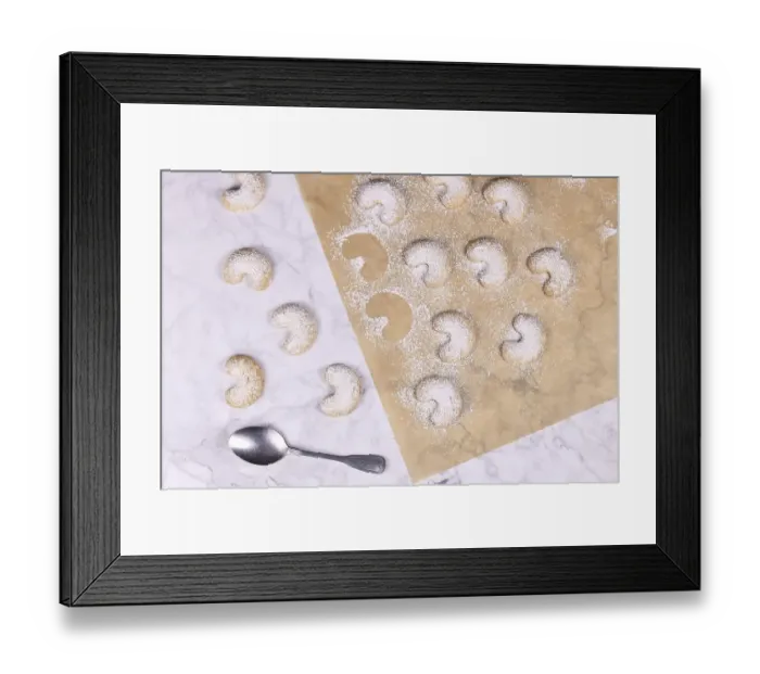 Framed Print : Traditional crescent shaped christmas cookies called Vanillekipferl Framed Print : Traditional crescent shaped christmas cookies called Vanillekipferl