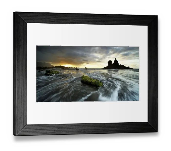 Framed Print : Dramatic cloud atmosphere with rock formation at sunset on the beach of Playa de Benijo