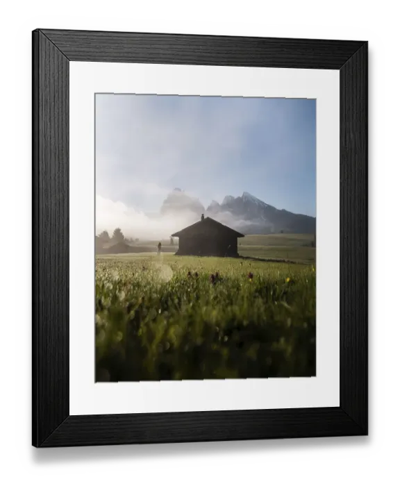 Framed Print : Woman looking on foggy meadow next to hut