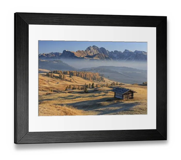 Framed Print : Small hut on alp in front of mountains in the morning light