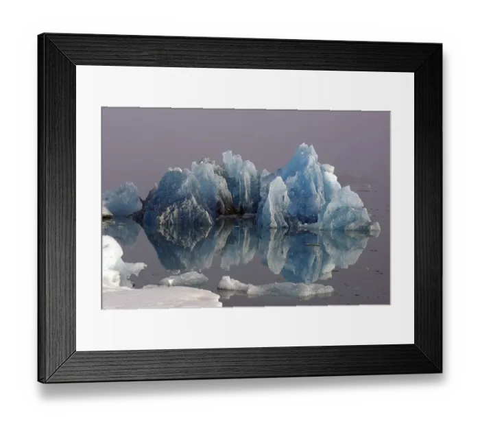 Framed Print : Blue iceberg reflected in the water
