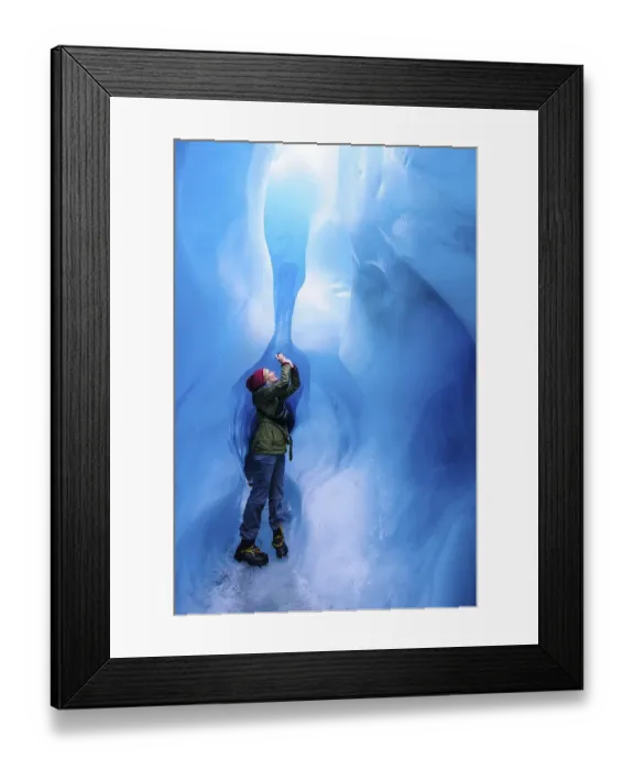 Framed Print : Woman photographing in a ice cave in Fox Glacier Framed Print : Woman photographing in a ice cave in Fox Glacier
