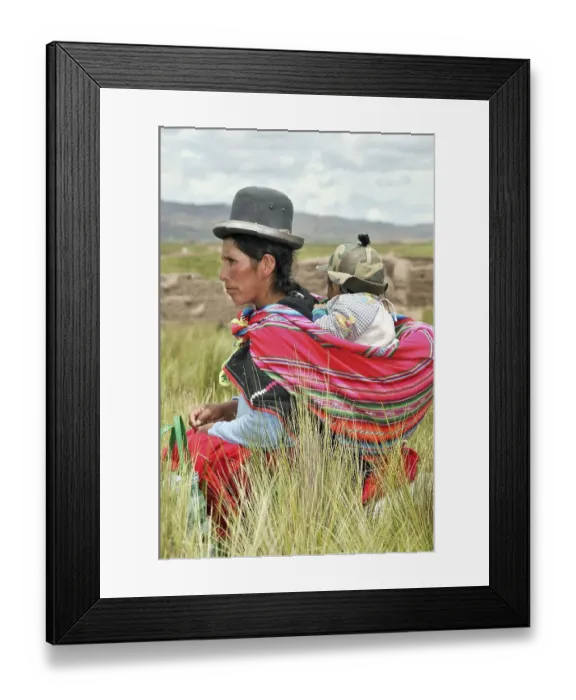 Framed Print : Mother with child in a sling, tall grass