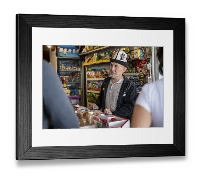 Framed Print : Man with traditional hat selling food Framed Print : Man with traditional hat selling food