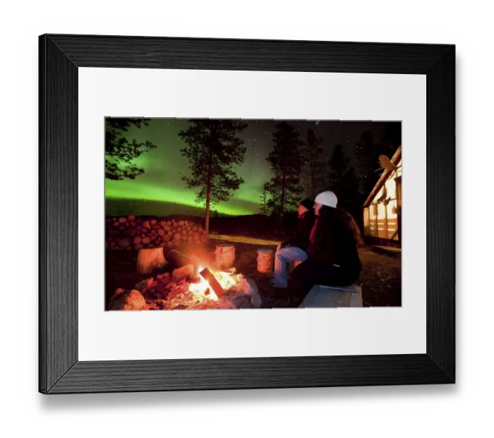 Framed Print : Young couple, woman and man, sitting at a camp fire Framed Print : Young couple, woman and man, sitting at a camp fire