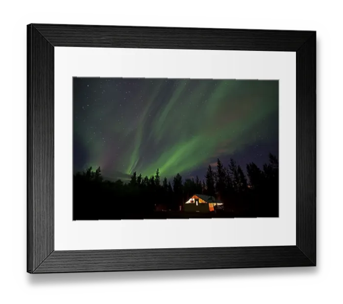 Framed Print : Curtains of northern polar lights and iluminated cabin