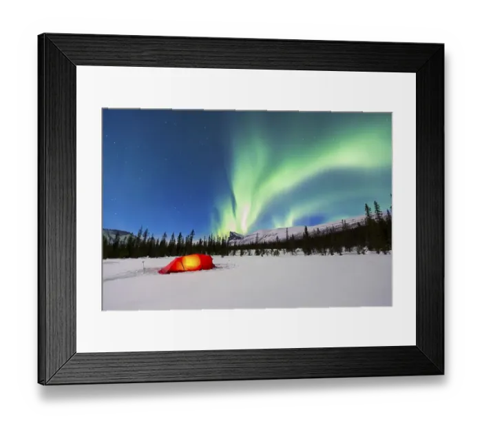 Framed Print : Northern Lights (Aurora borealis) above a red illuminated tent in winter
