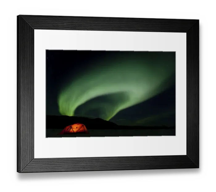 Framed Print : Illuminated expedition tent and traditional wooden snow shoes