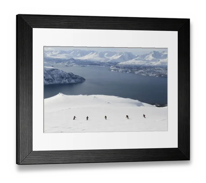 Framed Print : Ski touring group going downhill