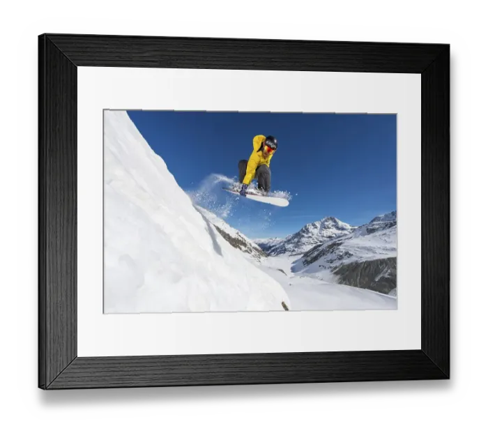Framed Print : Snowboarder jumping in deep snow