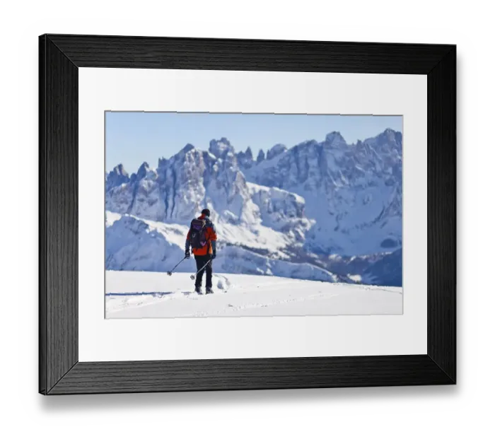 Framed Print : Cross country skier decending from Uribrutto through the Passo Valles