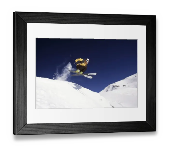 Framed Print : Skier jumps