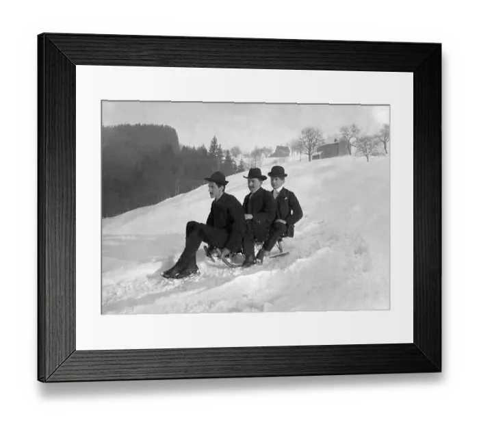 Framed Print : Three gentlemen riding a sled, historical image