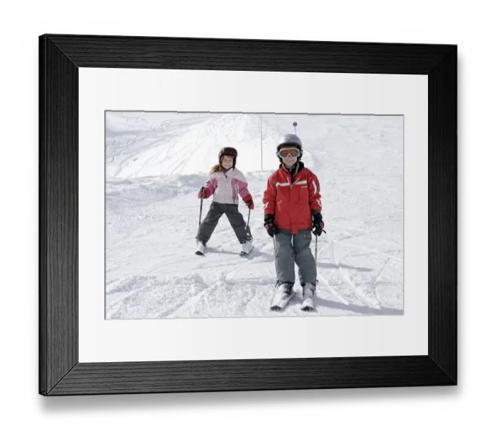 Framed Print : Two children skiing in the mountains
