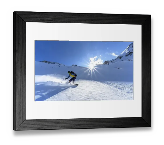 Framed Print : Snowboarder with splitboard rides in the snow Framed Print : Snowboarder with splitboard rides in the snow