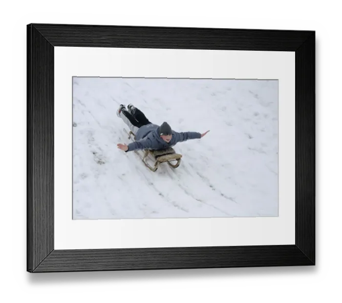 Framed Print : Boy, 12, tobogganing