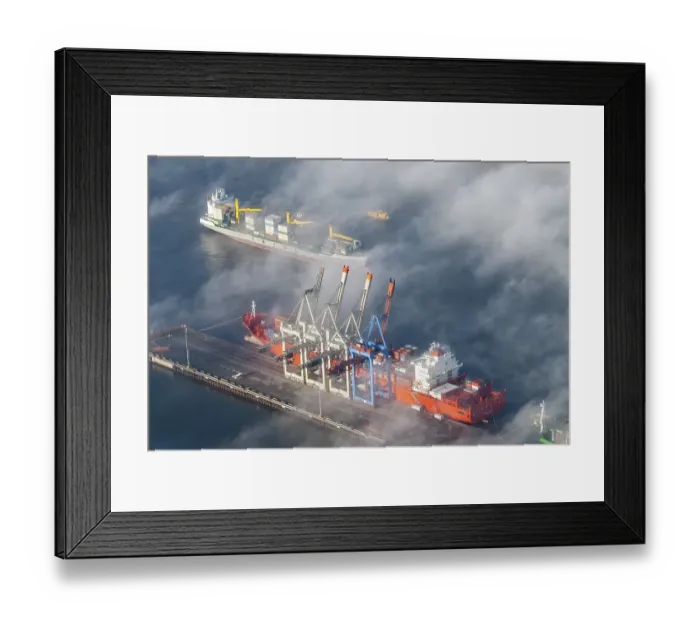 Framed Print : Aerial view of a container ship of the shipping company Hamburg Sued the Monte Olivia at the terminal Burchardkai Framed Print : Aerial view of a container ship of the shipping company Hamburg Sued the Monte Olivia at the terminal Burchardkai