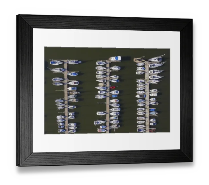 Framed Print : Aerial view over berthing jetty with sailing boats at marina in harbour of the city Stralsund along the Strelasund