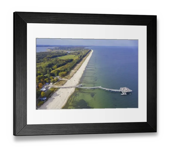 Framed Print : Aerial view over Koserow Pier, Seebruecke and Amber Beach on Usedom island in the Baltic Sea