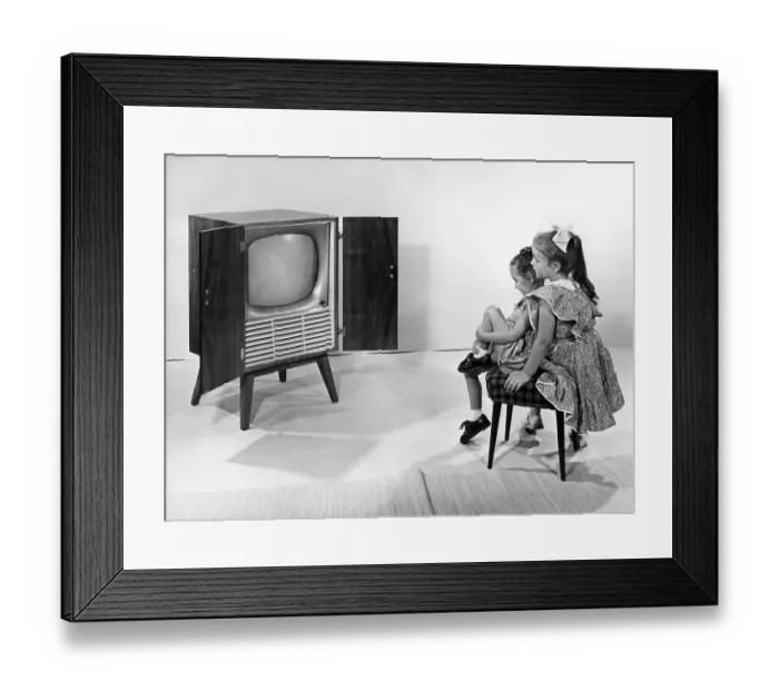 Framed Print : Two girls watching television, historic picture from about 1950 Framed Print : Two girls watching television, historic picture from about 1950