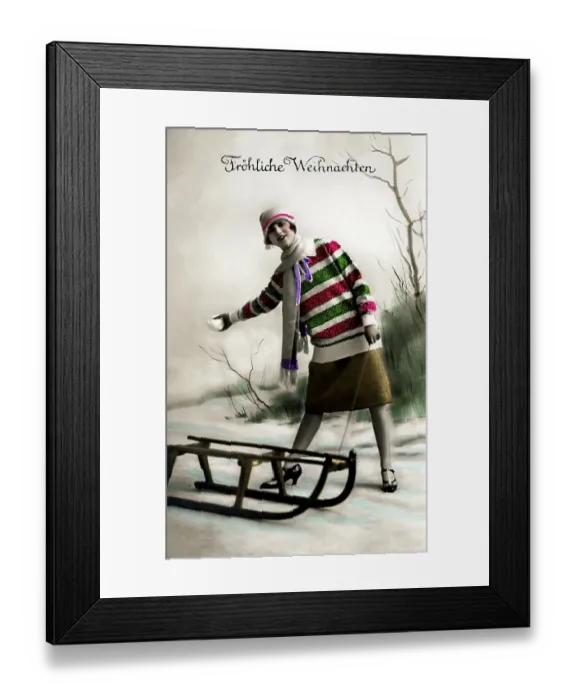Framed Print : Woman with sled, snow, Froehliche Weihnachten in writing Framed Print : Woman with sled, snow, Froehliche Weihnachten in writing