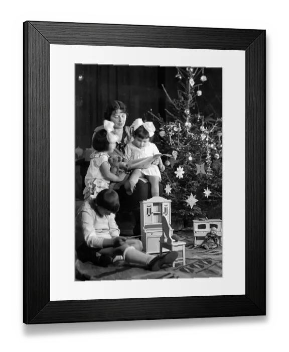 Framed Print : Family under the Christmas tree ca Framed Print : Family under the Christmas tree ca