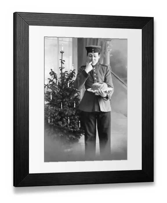 Framed Print : Historic photograph, person in uniform in front of a Christmas tree