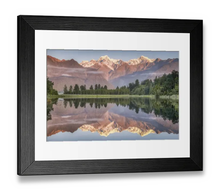 Framed Print : Snowy mountain peaks of Mount Cook and Mount Tasman reflected in Lake Matheson in the evening light