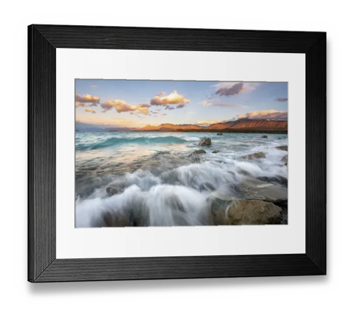 Framed Print : Stones on shore, lake with sunset swell