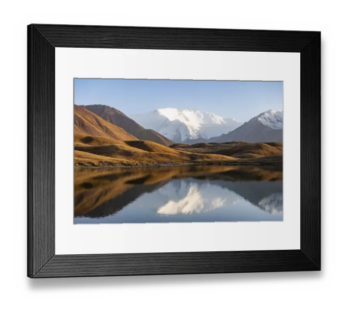 Framed Print : White glaciated and snowy mountain peak Pik Lenin at sunset