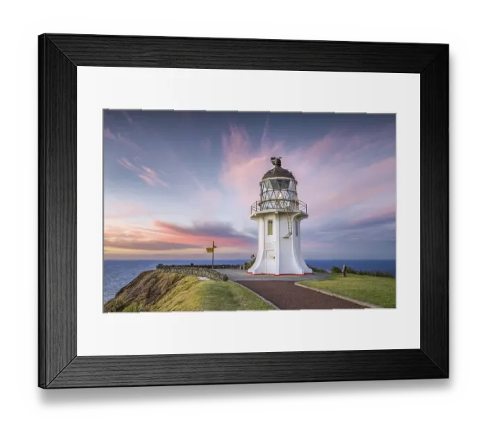 Framed Print : Lighthouse with signpost at Cape Reinga at sunset with pink clouds Framed Print : Lighthouse with signpost at Cape Reinga at sunset with pink clouds