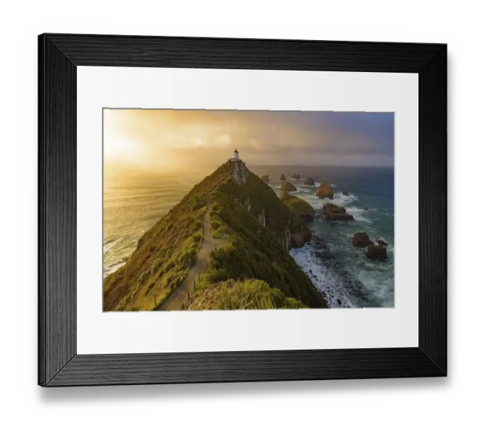 Framed Print : Nugget Point and lighthouse with sunrise at South Island