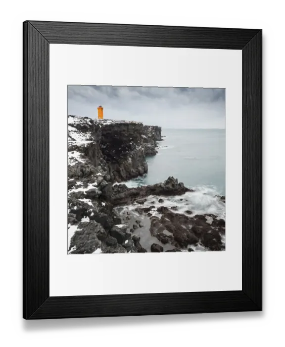 Framed Print : Orange lighthouse Oendverdarnes stands on a dark cliff