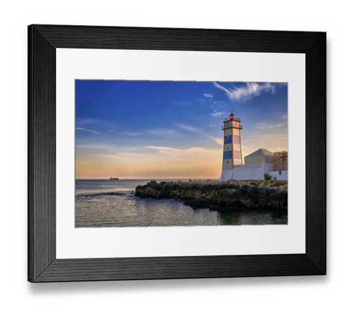 Framed Print : Dramatic sunset on sea shore and Santa Marta lighthouse in Cascais Framed Print : Dramatic sunset on sea shore and Santa Marta lighthouse in Cascais