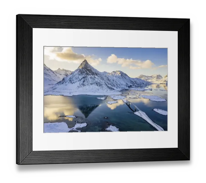 Framed Print : Mountain Volandstinden reflected in Fjord